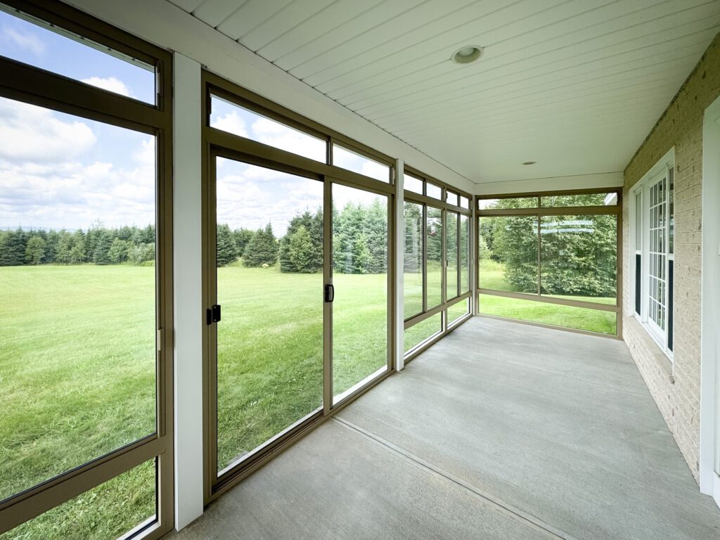 Modern glass patio cover installed by DekKor Outdoor in Colorado