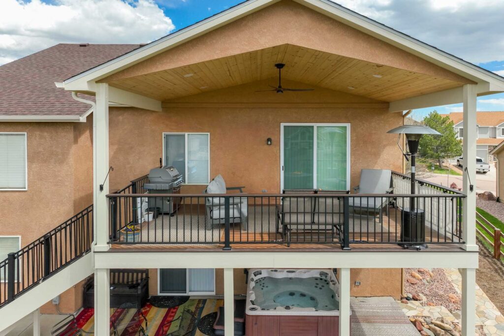 A crew providing expert deck construction services building the frame of a new deck