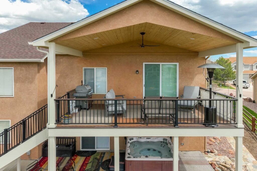 A crew providing expert deck construction services building the frame of a new deck